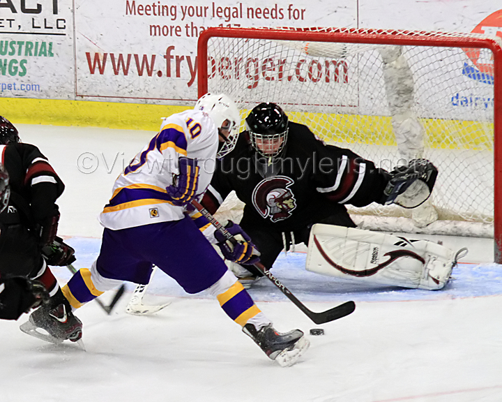 Cloquet's Adam Hanson makes a move on New Prague's goaltender.