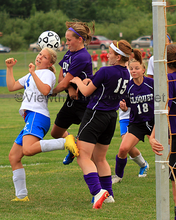 Esko's Dallas Cossalter battles Cloquet's Carley Esse and Kristi Konietzko in front of the Lumberjacks goal