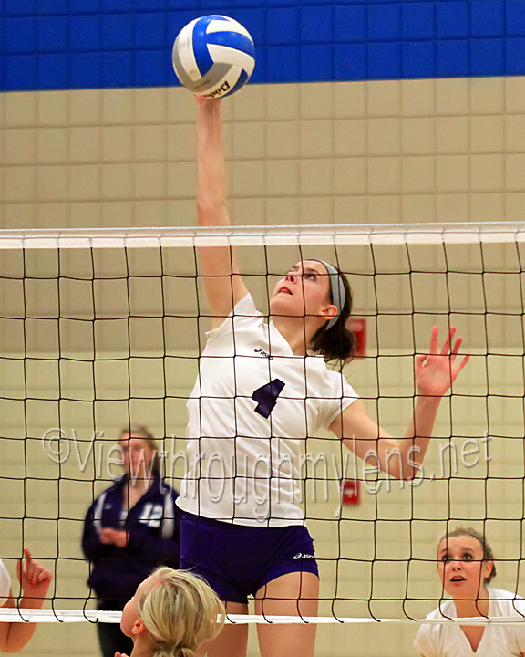 Cloquet's Kristie Wappes goes up high to kill a free ball vs Hermantown