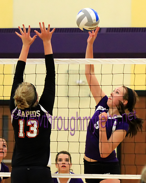 Senior hitter Emily Fossen hits against Grand Rapids' Dakota Flohaug