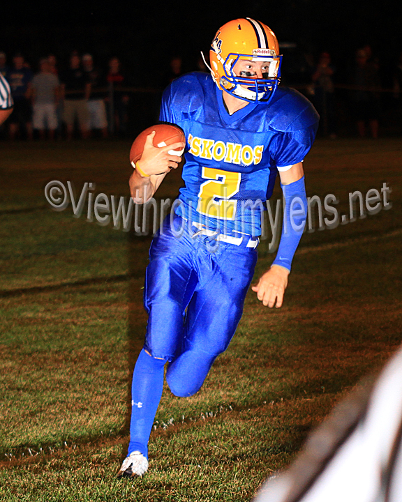 Max Reinertsen runs the ball during a football battle with Braham