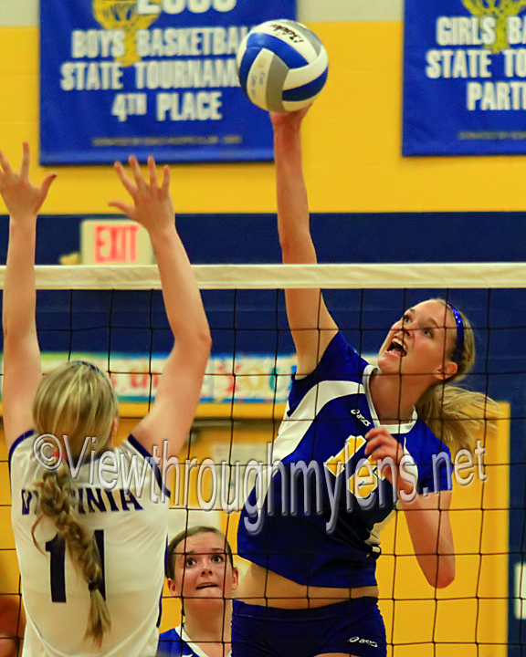 Esko's Stephanie Bandelin hits over Virginia's Kristen Predovich during the Eskomos 5 set win