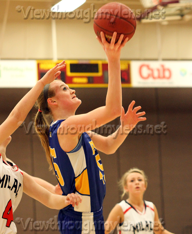 Molly Trapp makes a layup while being fouled vs, Milaca in the 7AA semifinal game Tuesday night.