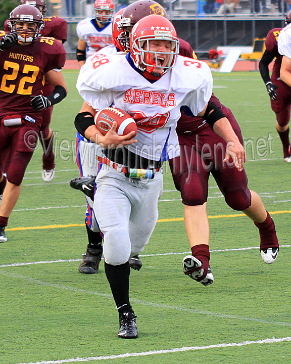 Rebels' RB Chris Gassert runs for one of his four touchdowns vs Duluth Denfeld