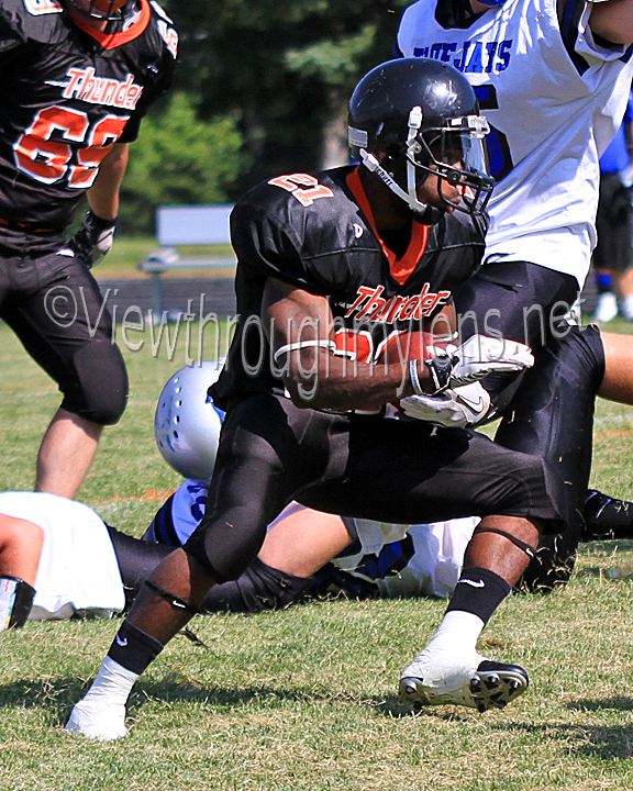 Thunder Running back John Brown makes a move after getting through the line