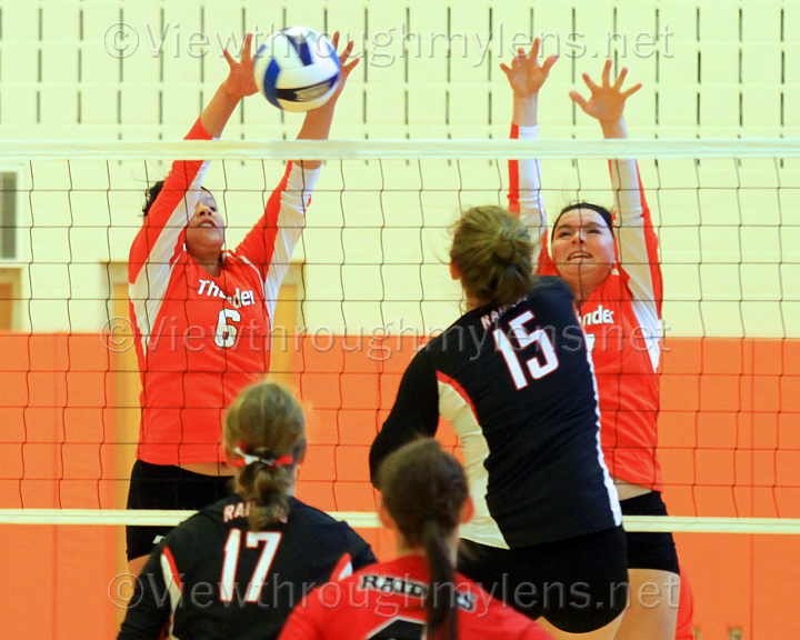 Marita Yellowhammer makes a block on Central Lakes’ Alanna Hansen