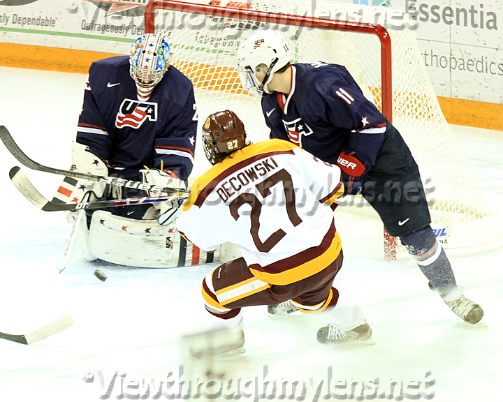 Bulldog forward Cal Decowski  puts a shot on USA U18’s goaltender Thatcher Demko Saturday afternoon.