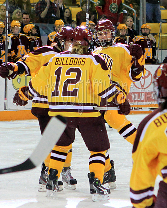 Jenna McParland celebrates her game tying goal with Tea Villila (left) and Haley Irwin.