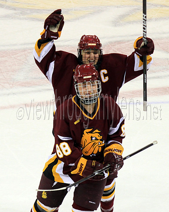 Kacy Ambroz celebrates Brigette Lacquette's shorthanded empty net goal to ice the game vs Wisconsin