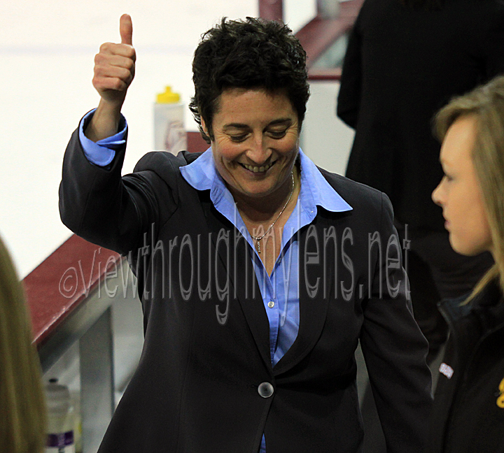 Head Coach Shannon Miller gives a thumbs up to the crowd after UMD's win Friday